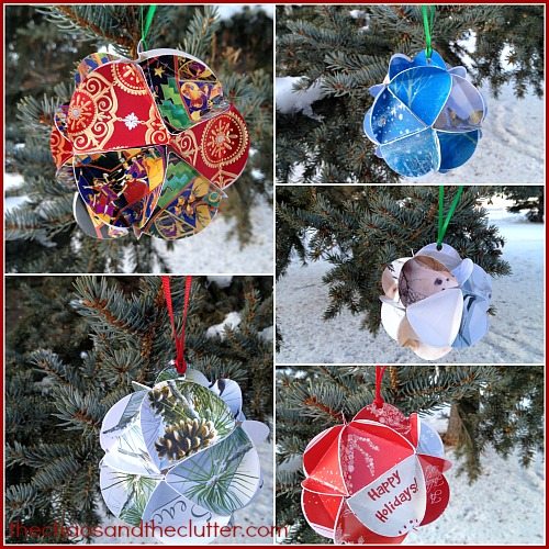 circle Christmas card ornaments hanging on pine trees outside