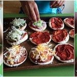 kids making mini pita pizzas
