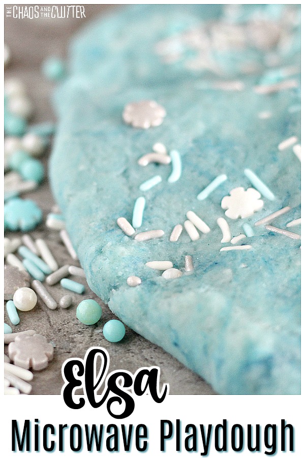 light blue dough pressed down with white, silver, and blue sprinkles and text reads "Elsa microwave playdough"