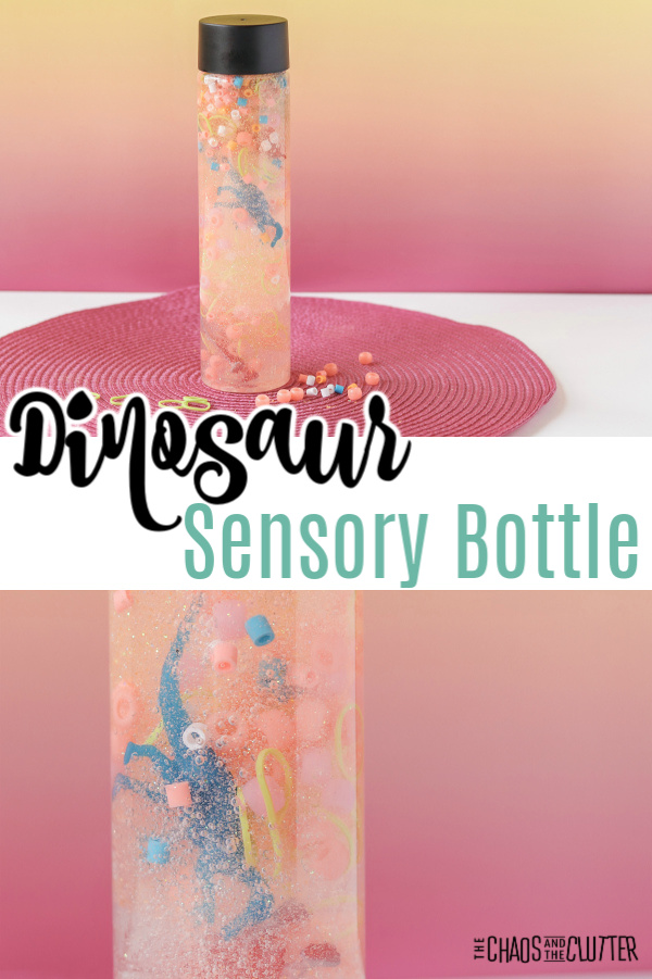 liquid filled bottle on a round pink mat with text that reads "Dinosaur Sensory Bottle"