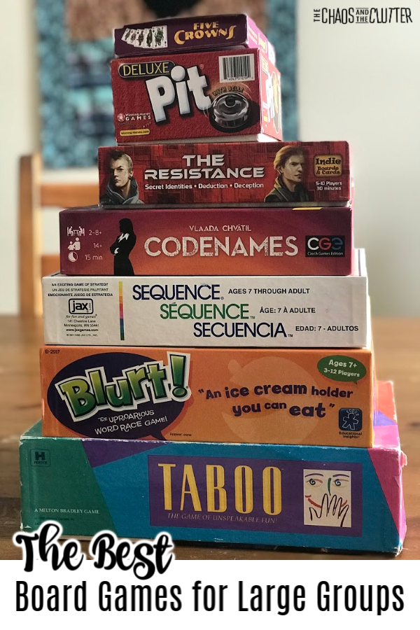 stack of games in boxes and text that reads "The best board games for large groups"