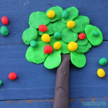 apple tree made out of playdough on a blue background