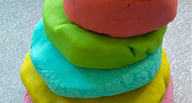balls of playdough in 6 colours stacked on top of each other