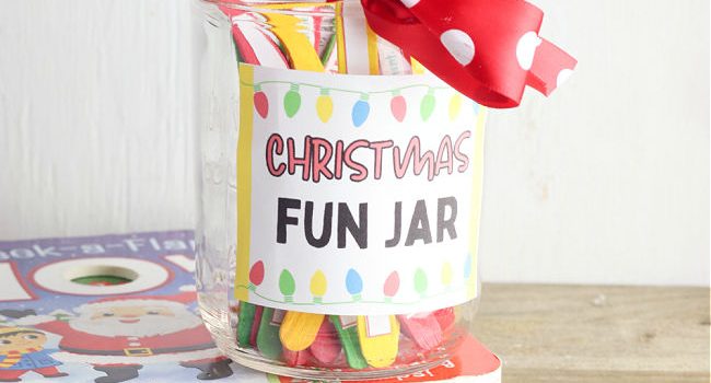 clear jar with red and white polka dot ribbon on the top and the words "Christmas Fun Jar" on the side