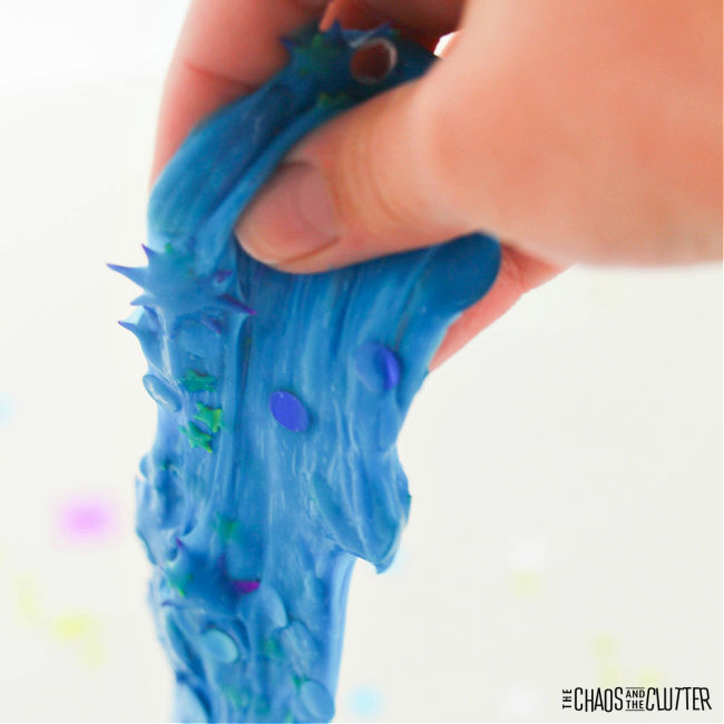 hand pulling up blue slime
