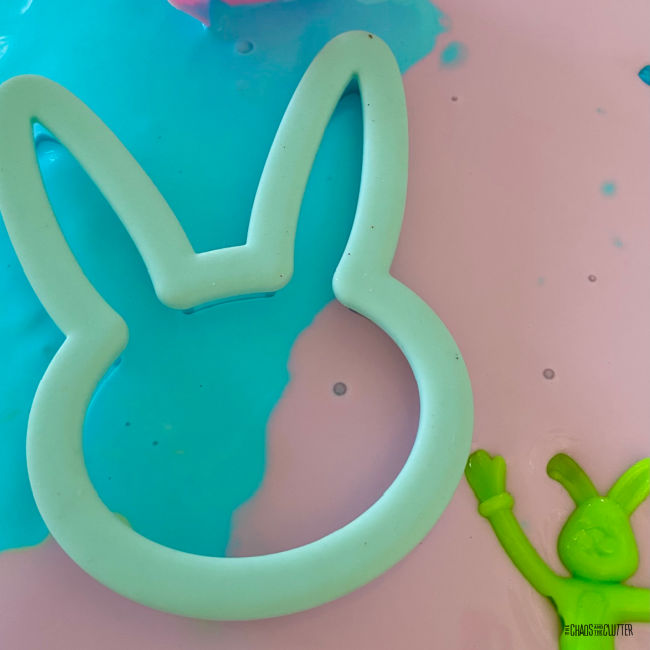 bunny cookie cutter on pink and blue oobleck