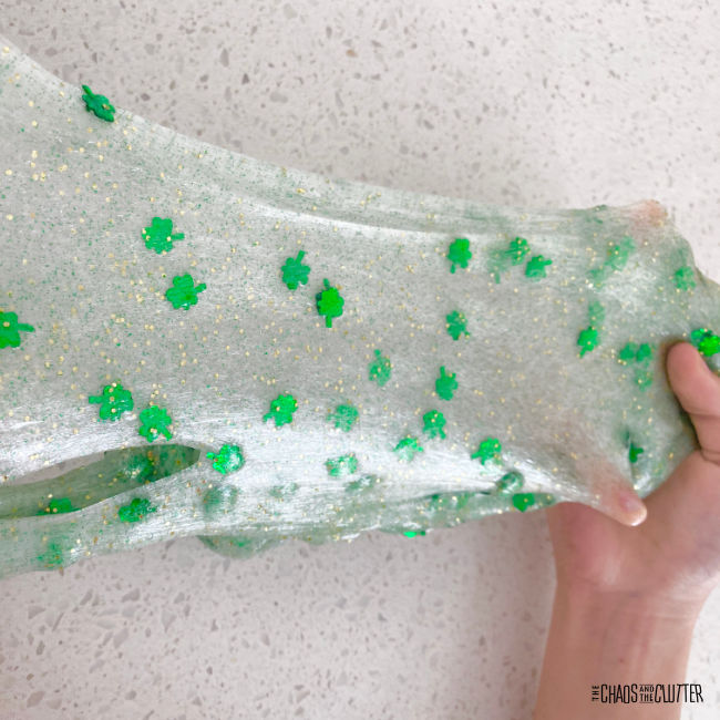 stretching out slime with green shamrocks in it