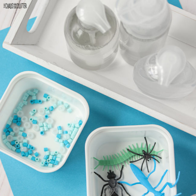 blue beads, hand soap dispensers, and plastic bugs